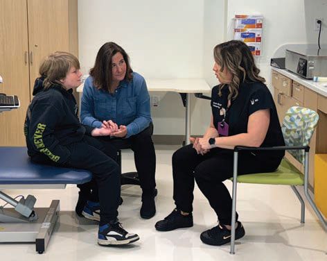 Dr. Bielicka working with John