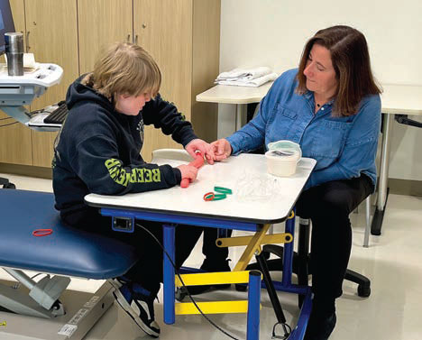 A variety of exercises help John Evans restore hand and finger function