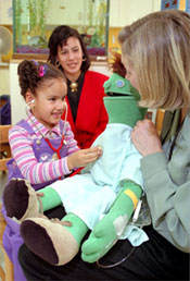 Girl Using Stethoscope on Puppet