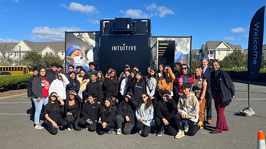 Students from Long Branch Middle School gather outside the TOME Truck.