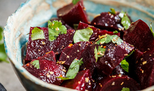 roasted beets cut into cubes covered with herbs