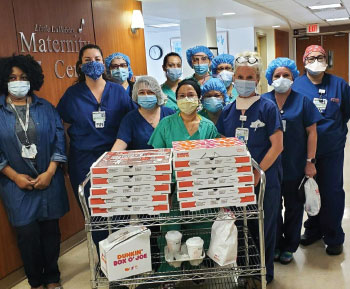 The Montclair Alumni Chapter of Kappa Alpha PSI Fraternity donated an assortment of pizzas, cold beverages and dessert to the Maternal Care Services team