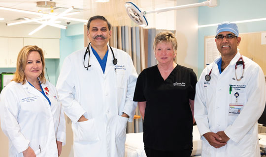 The TAVR team at Jersey
City Medical Center includes
(from left) Kimberly Skelding,
MD; Deepak Singh, MD; Lori
Pennell, APNC; and Michael
Benz, MD. 