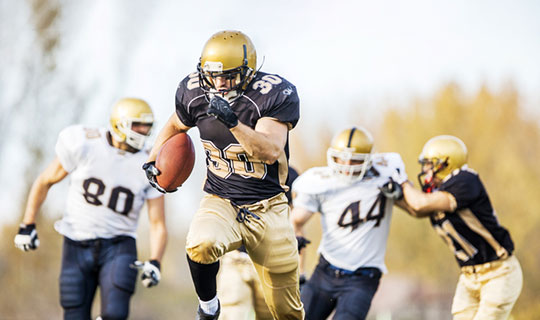 football player running with the ball