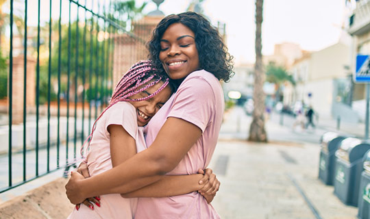 mom and child hugging