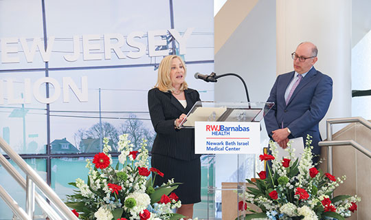 Amy Schechner, HFNJ Board Chair speaking at the event with Michael Schmidt, Executive Director/CEO, HFNJ