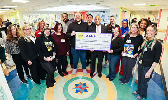 Leadership from NBI and Spirit of Children group photo with check donation