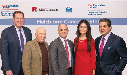 At the signing ceremony for the new Melchiorre Cancer Center are Richard L. Davis, Bruce Schonbraun, Anthony and Andrea Melchiorre, and Mark E. Manigan