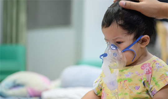 child with oxygen mask