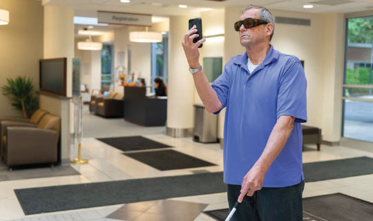 visually impaired person using Aira technology