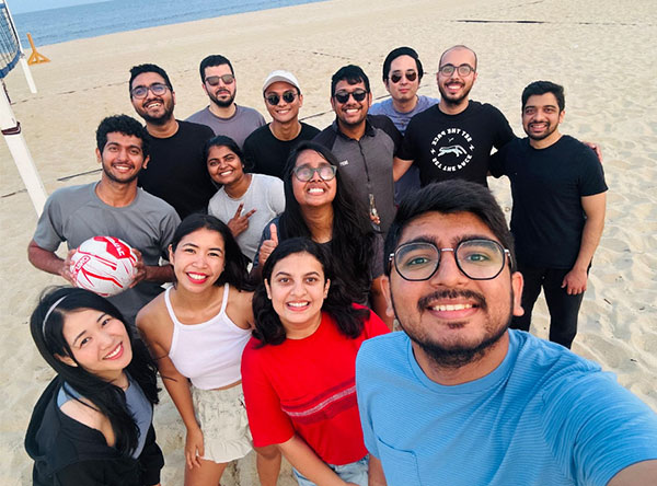 MMC Internal Medicine residents group photo on the beach playing volleyball