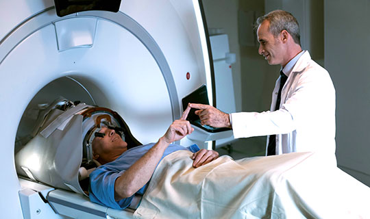 physician giving the patient a physiological test during focused ultrasound treatment