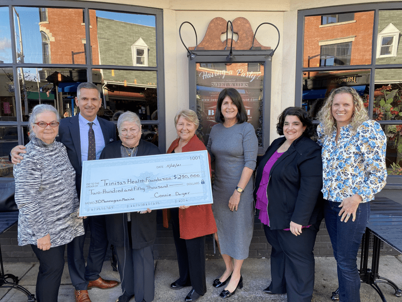 group of people holding check